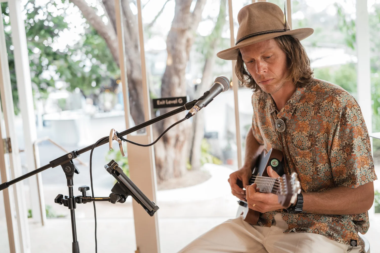 Solo acoustic musician performing quietly