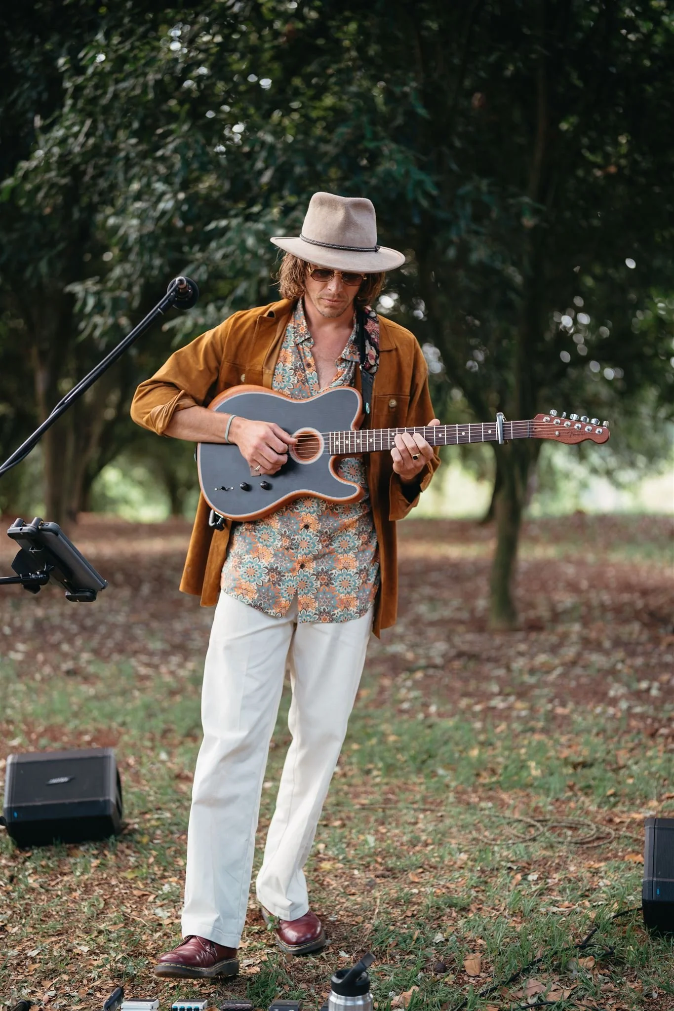 Solo acoustic musician performing outdoors